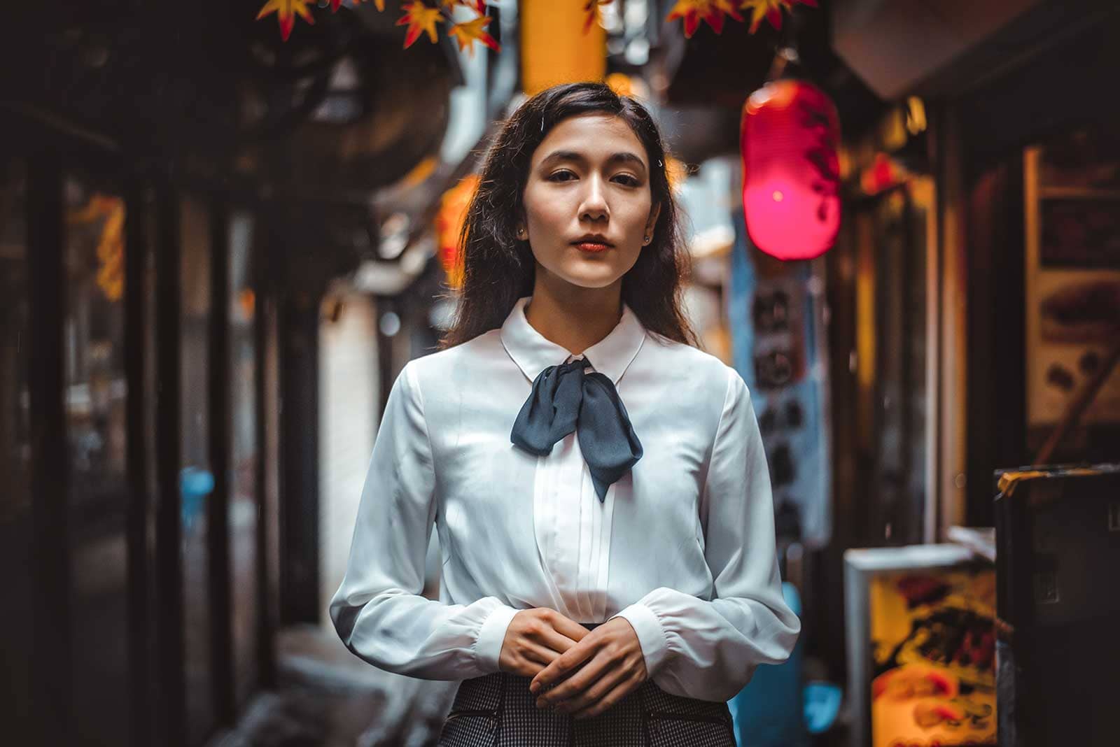 Portrait of a woman in Japanese town after editing using Lightroom portrait preset