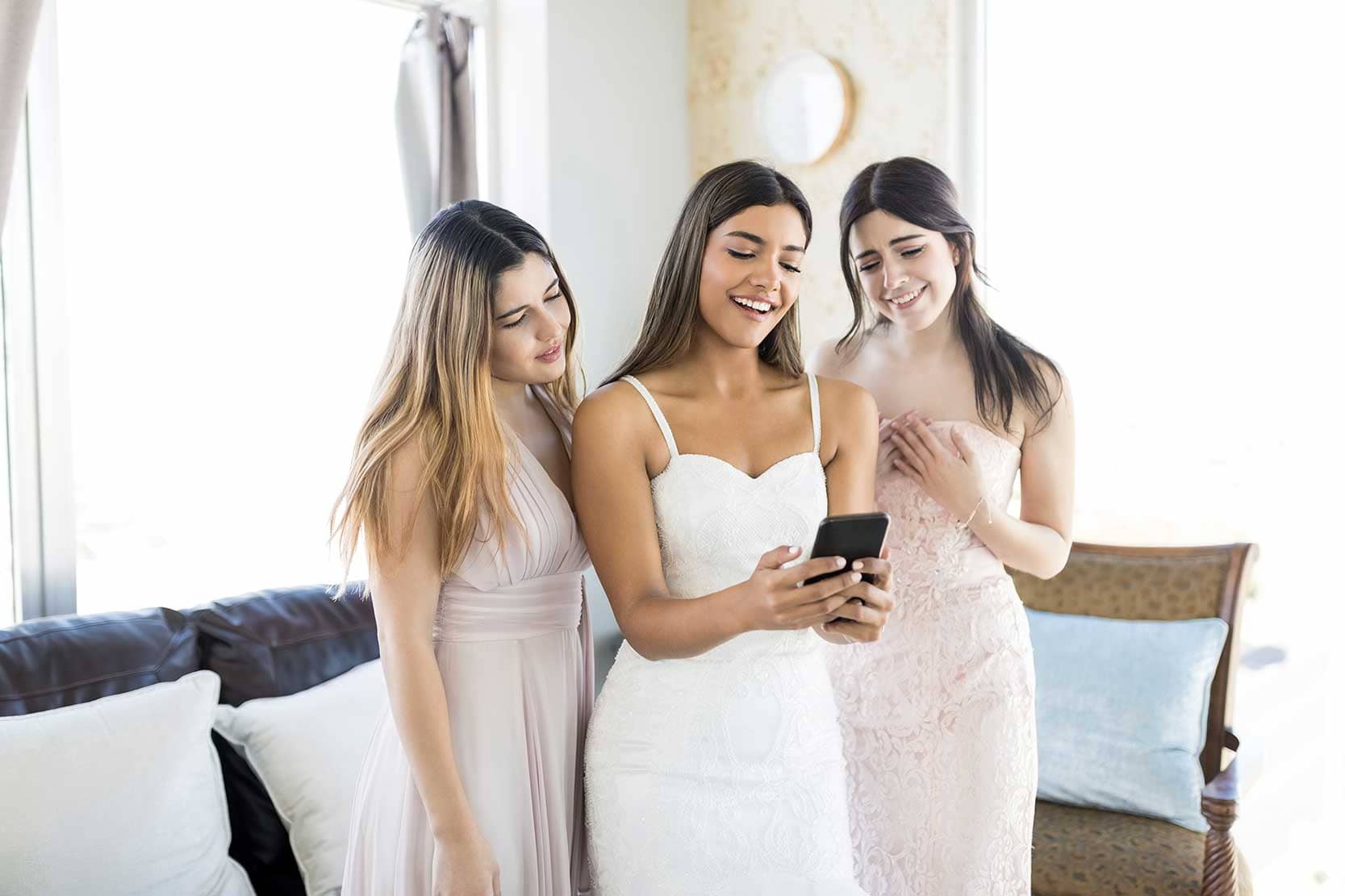 Bridesmaids looking at a smartphone