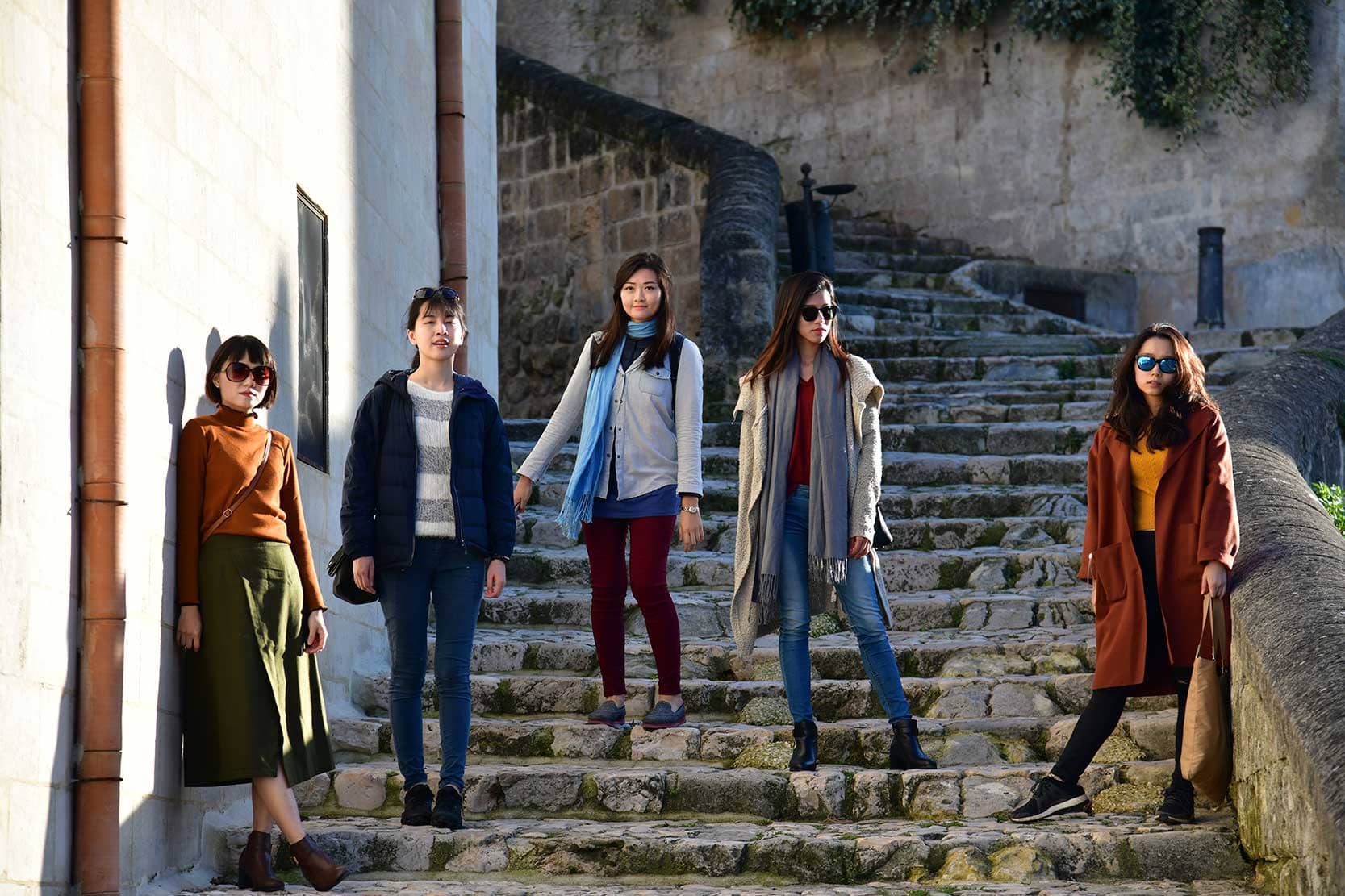 Asian friends posing as fashion models in Italy