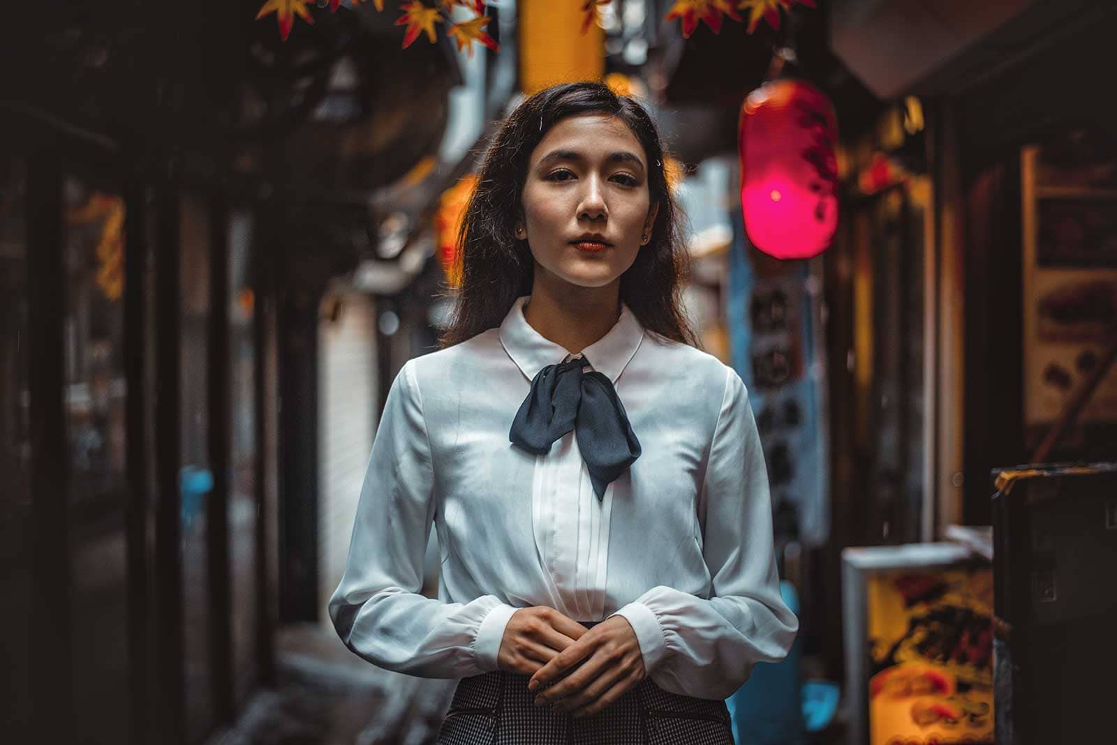 Portrait of a woman in a Japanese town before edit